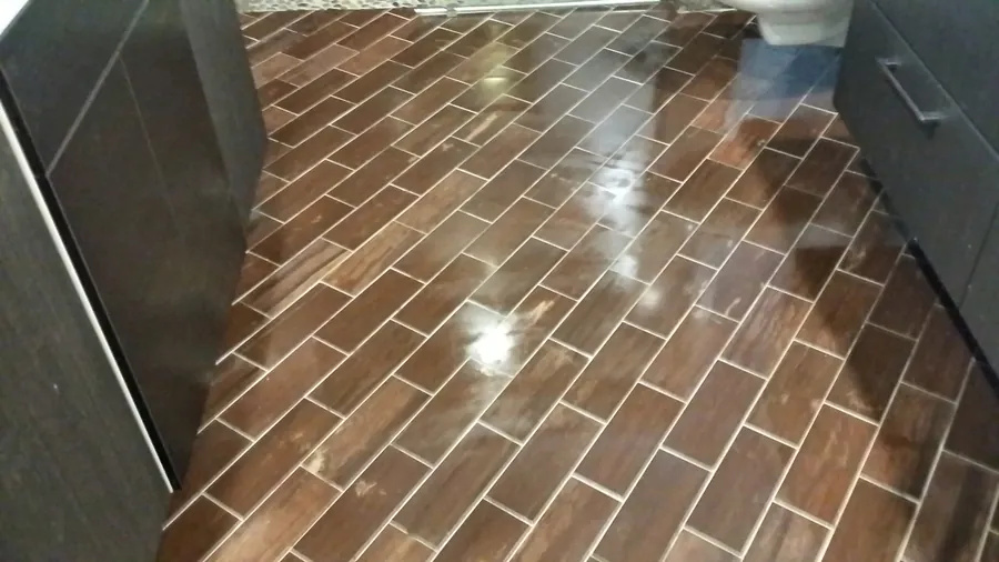 Rich brown rectangular tile laid in a brick pattern.