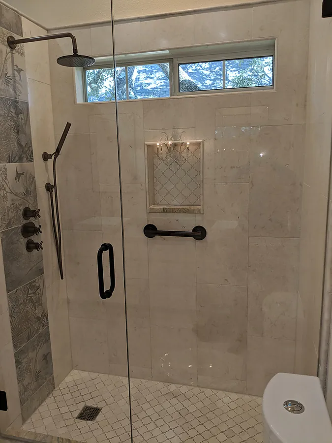 An inviting walk-in shower with a glass enclosure.
