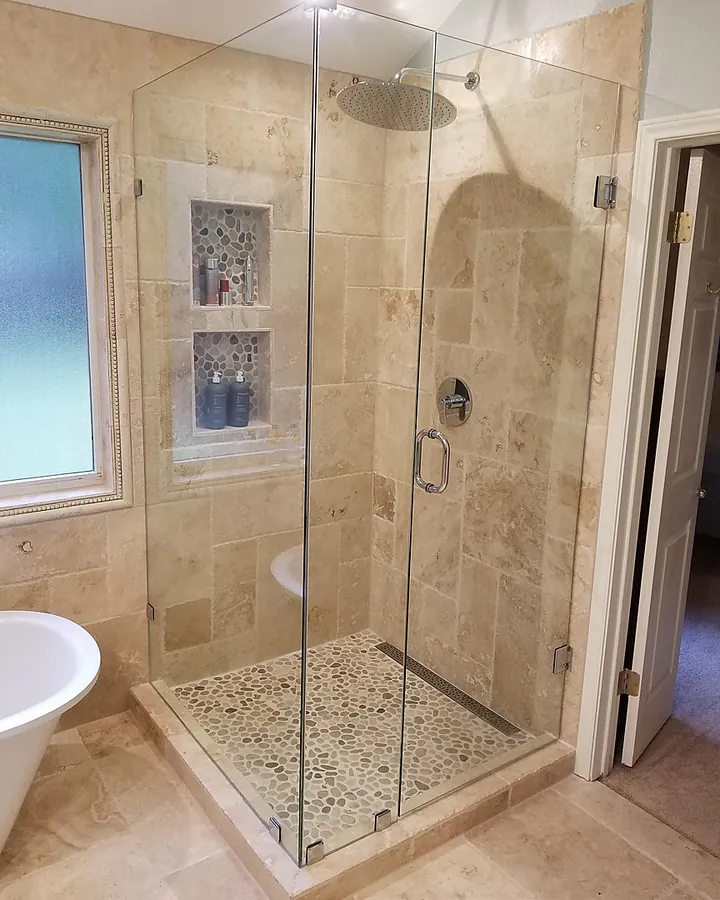 Neutral stonework, inset niche and clear glass.