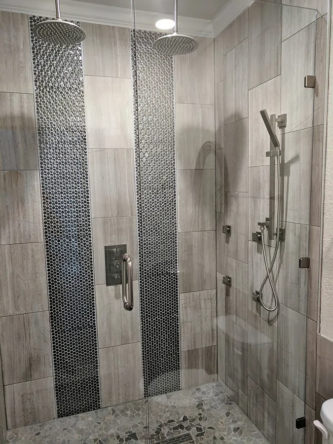 Light stonework with dark vertical feature strips.